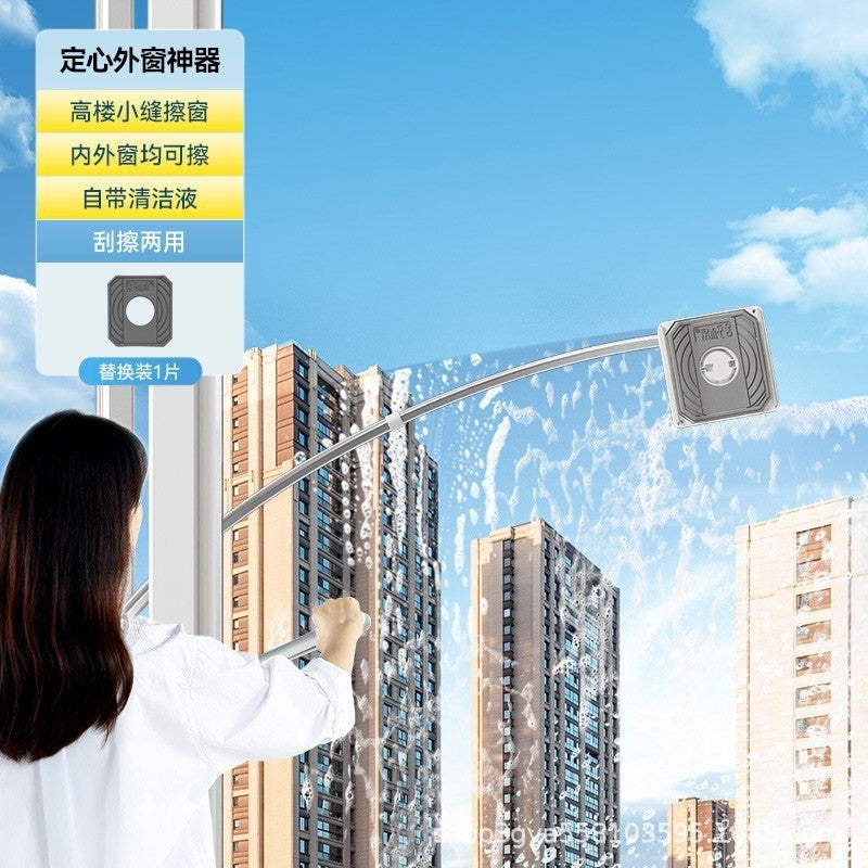 Person cleaning windows with a tool against a blue sky and building background