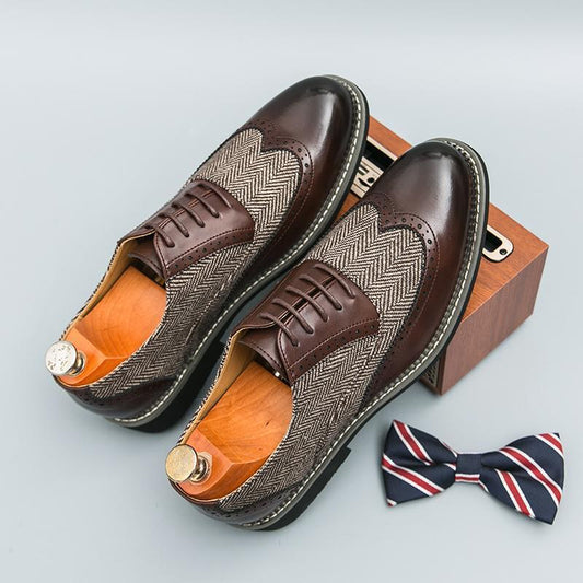 Brown dress shoes with herringbone pattern and wooden sole, accompanied by a bow tie on a light gray background.