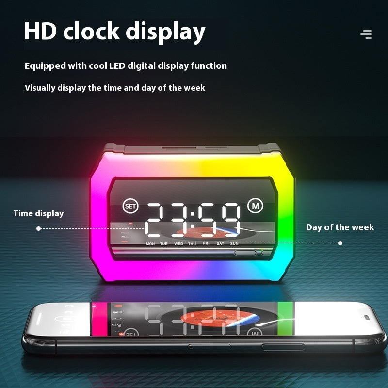 Colorful digital clock with LED display on a dark background