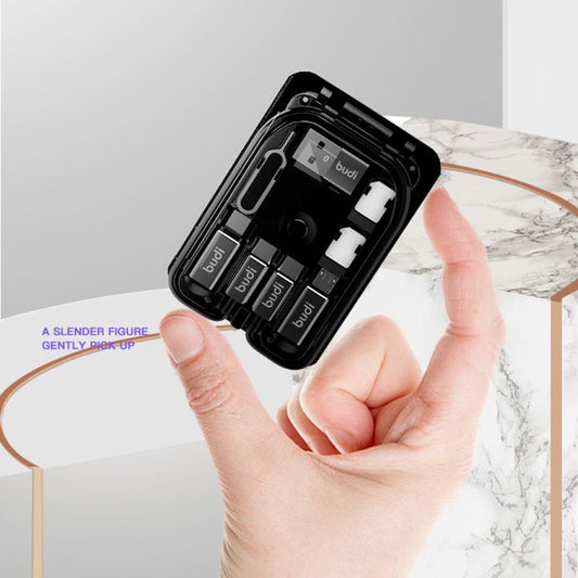 Black case with 'budi' branding held by a hand on a marble surface