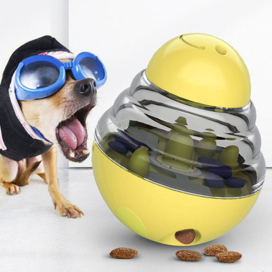 A dog wearing blue and black goggles is depicted reacting to a yellow and clear dog toy designed to dispense treats, with the toy shown in an upright position.