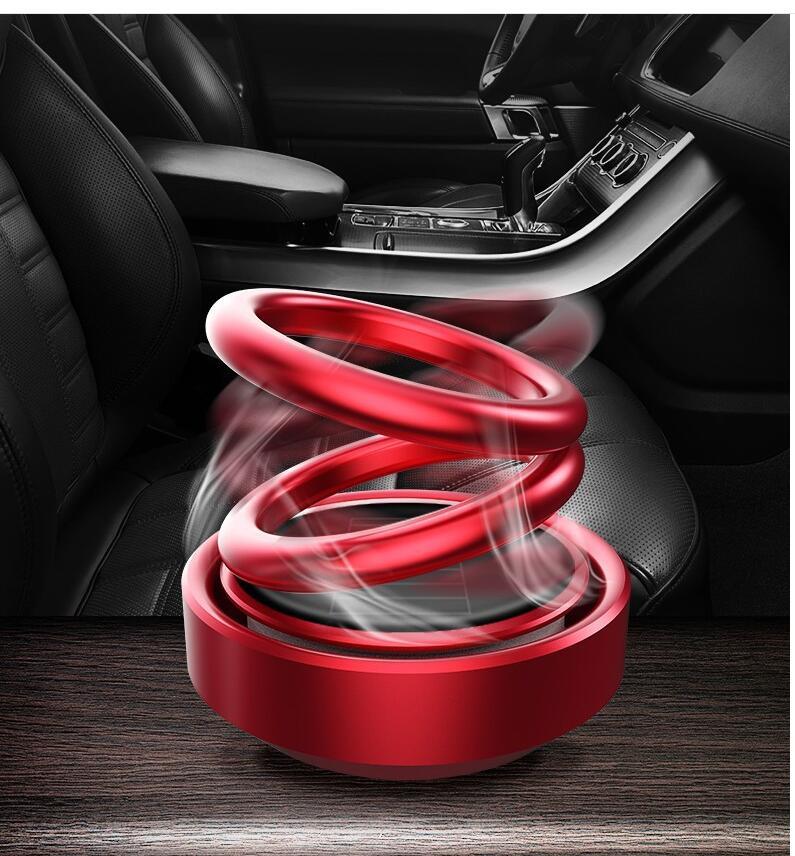 Red car suspension coil on a car interior background