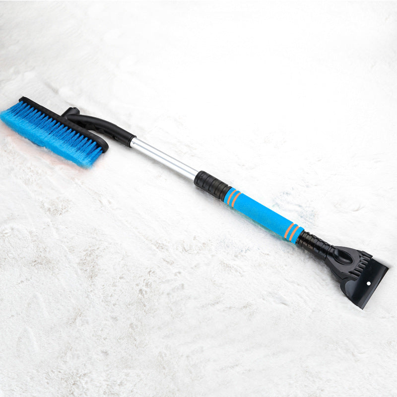 Snow brush with ice scraper on a white background