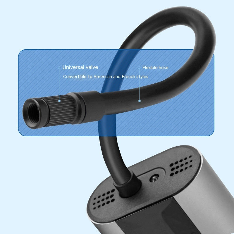 Black flexible hose with valve attachment on a blue background