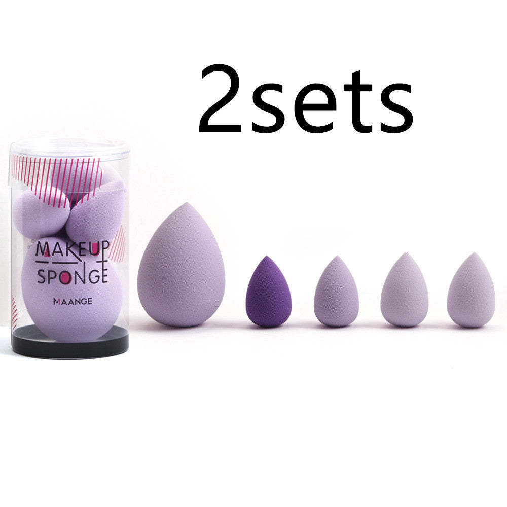 Makeup sponges with a container labeled 'MAKEUP SPONGE' on a white background.
