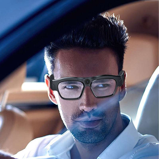 Man wearing smart glasses inside a vehicle
