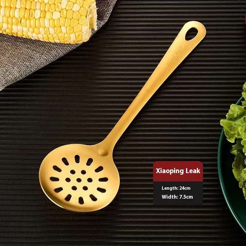 Gold-colored slotted spoon on a dark surface with a label indicating 'Xiaoping Leak' details.