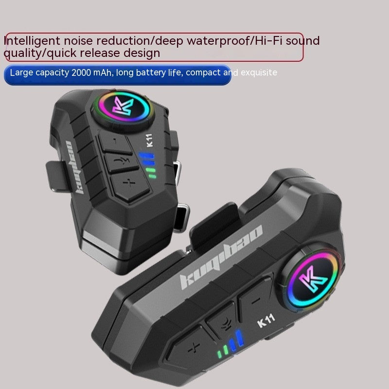 Two motorcycle communication devices with colorful display on a gray background