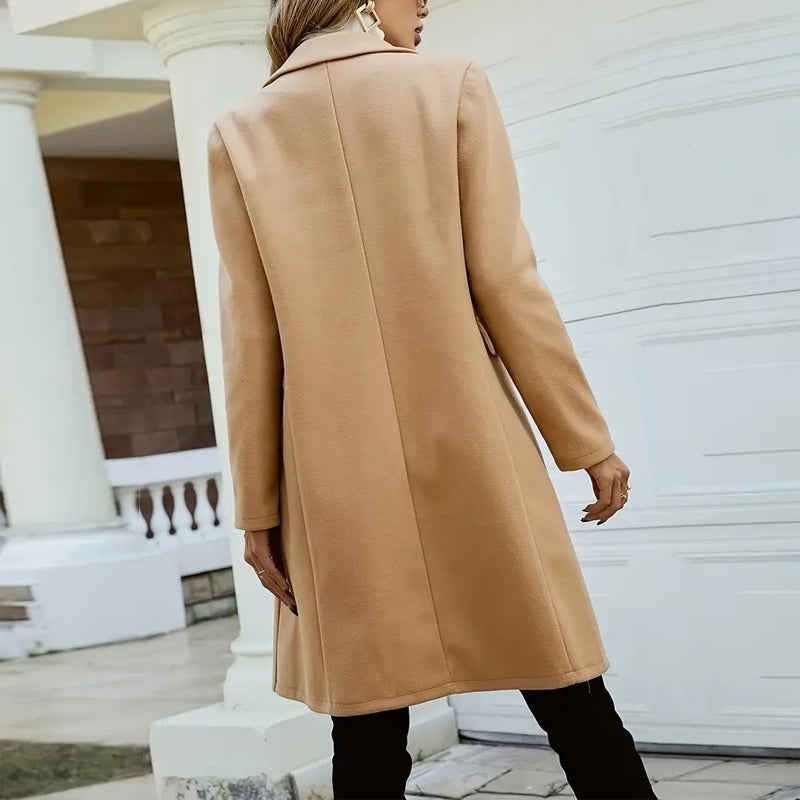 Tan mid-length coat back view with seams and long sleeves