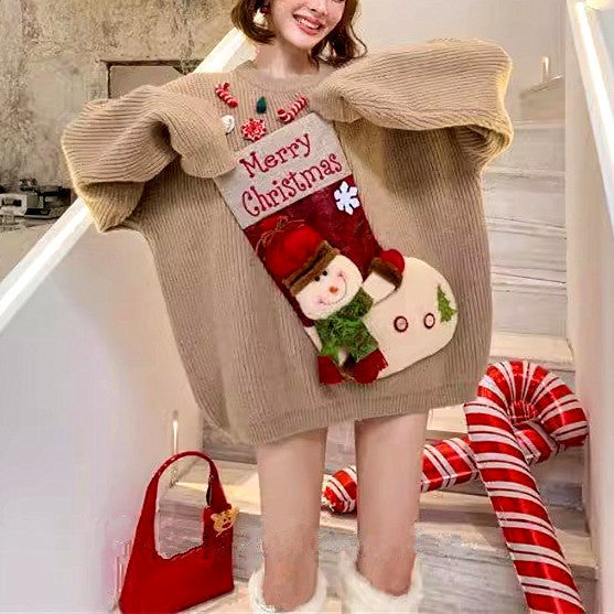 Person wearing a Christmas-themed sweater with stockings, standing on a staircase.
