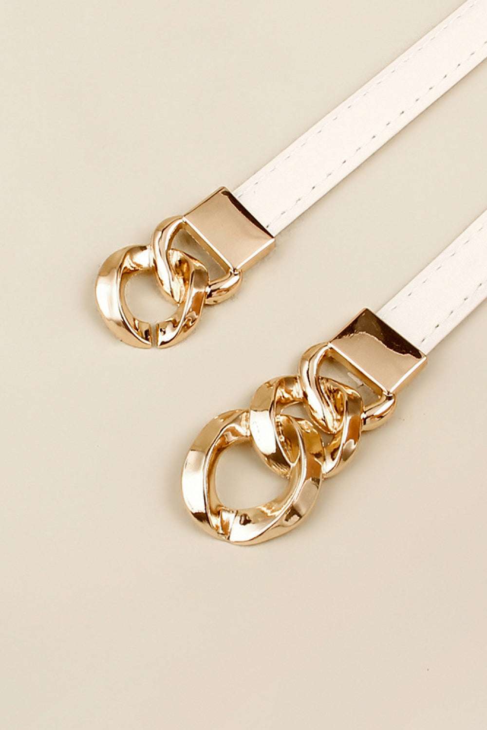 White PU skinny belt with gold chain buckle and square clasp close-up