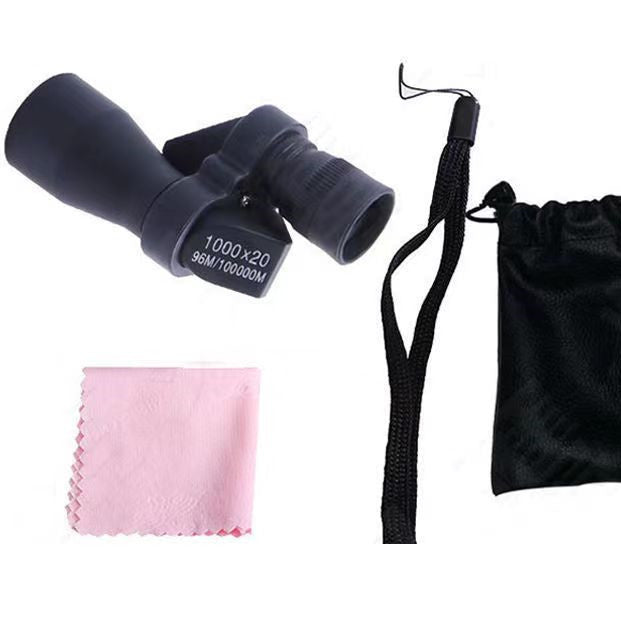 Black binoculars with pink cleaning cloth and black drawstring pouch on a white background