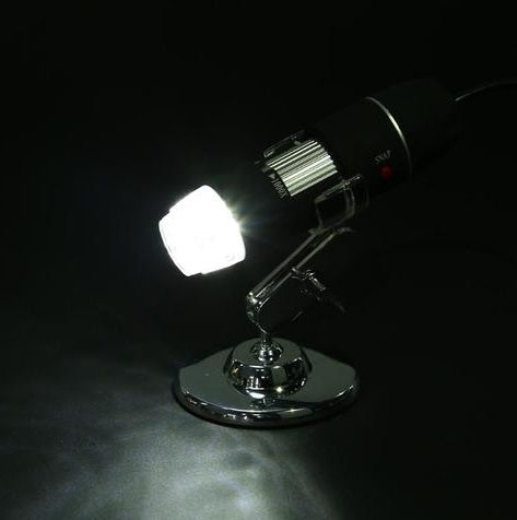 Chrome spotlight with a bright light on a dark background