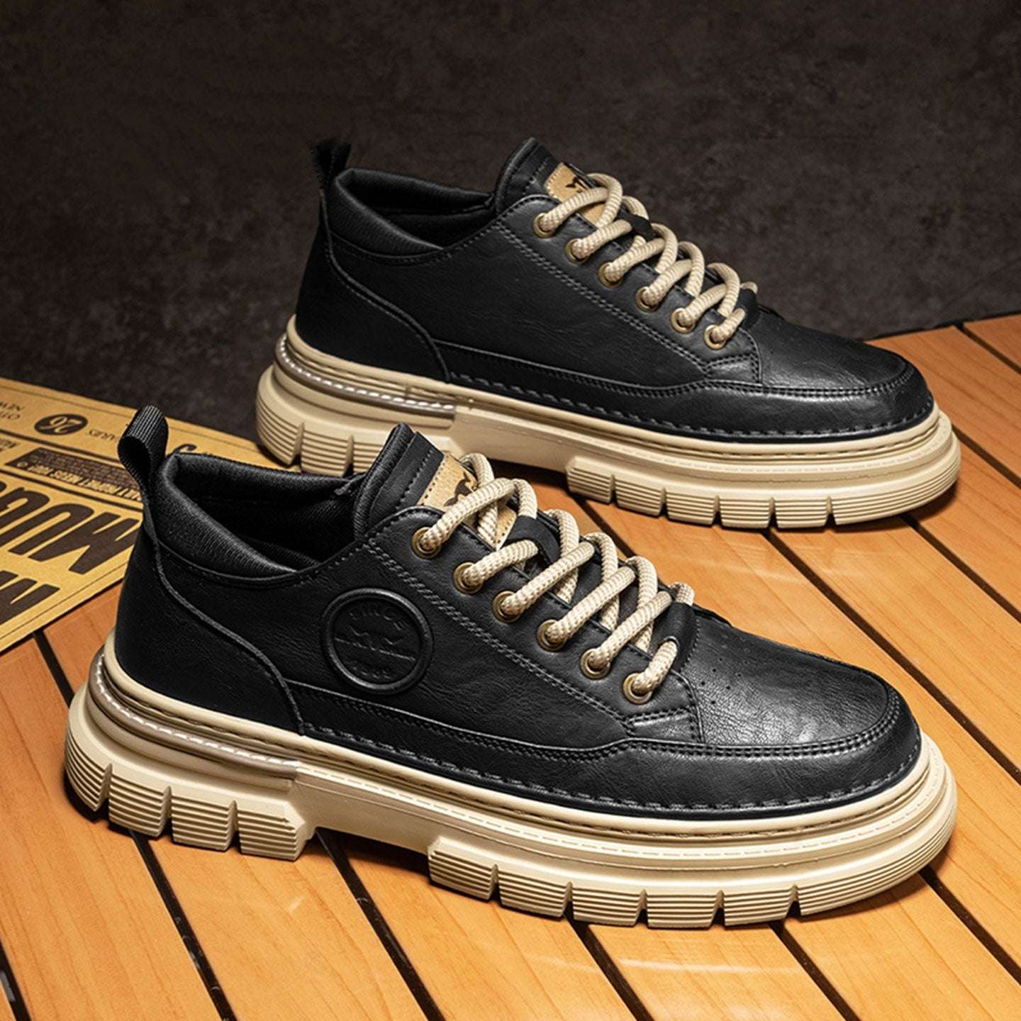Black sneakers with white soles on a wooden floor