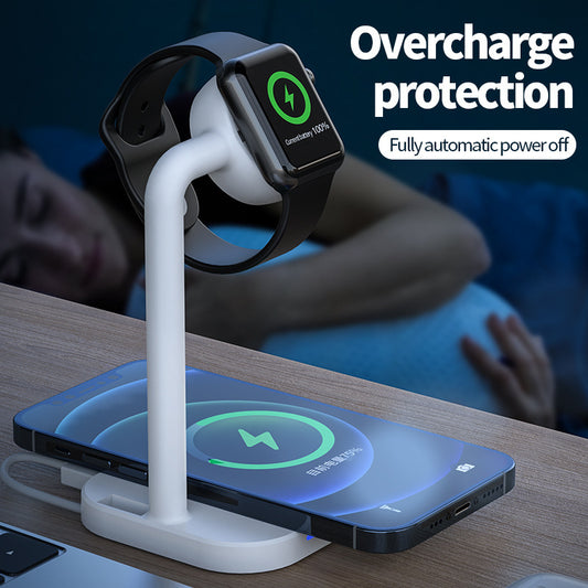 Wireless charging station with a smartwatch and phone on a wooden surface, with text 'Overcharge protection' and 'Fully automatic power off'.