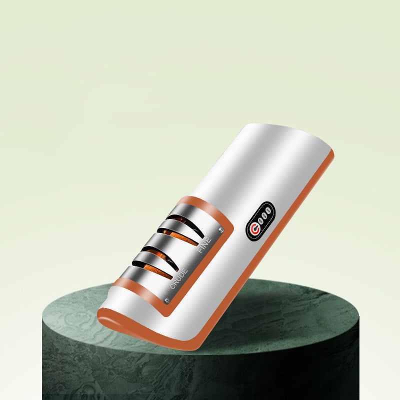 Electric knife sharpener close-up with white housing, orange-edged base, and roller head