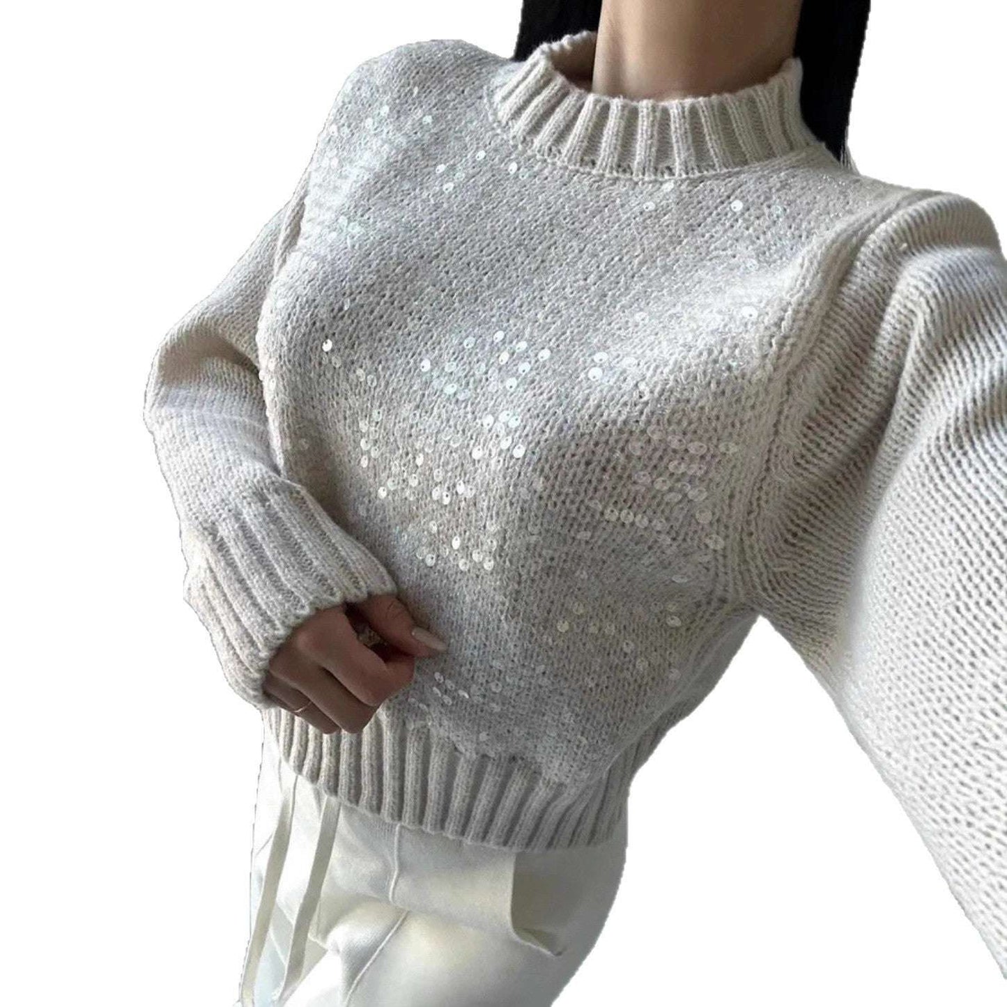 White sequin sweater on a mannequin against a white background