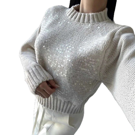 White sequin sweater on a mannequin against a white background