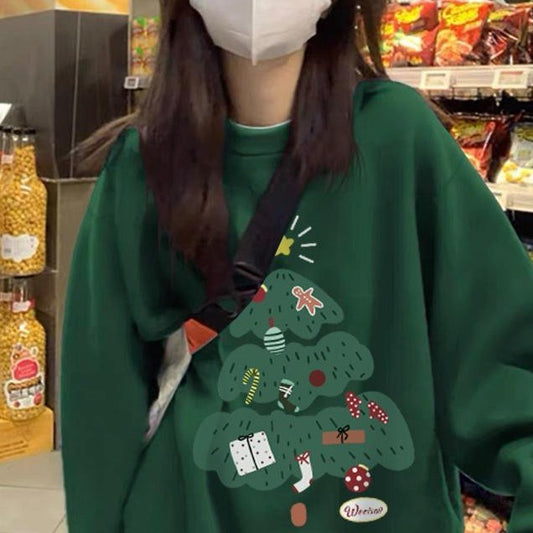 Person wearing a green hoodie with a Christmas tree design in a store.