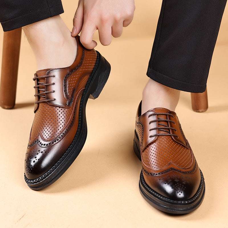 Brown leather dress shoes with black soles worn by a person on a beige background