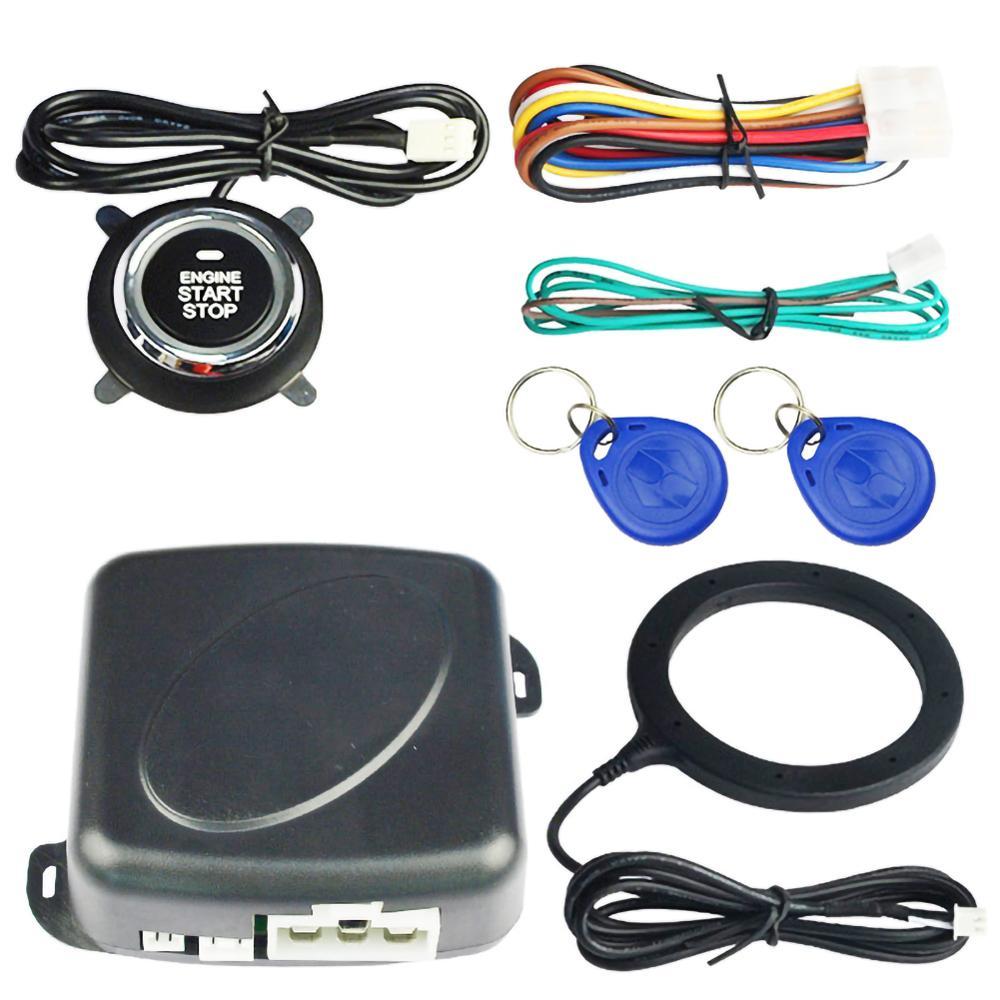 Car alarm system components including a push button, wiring harnesses, key fobs, and a control module