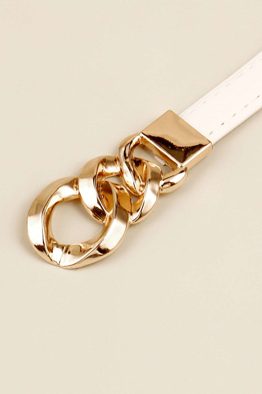 White PU skinny belt with gold chain buckle and square clasp close-up