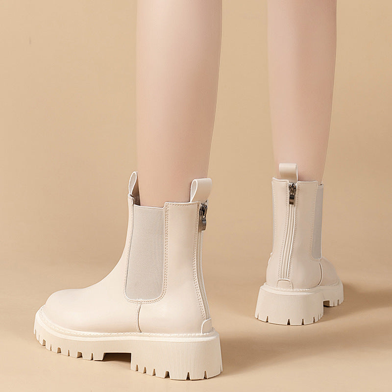 White chunky boots on a beige background