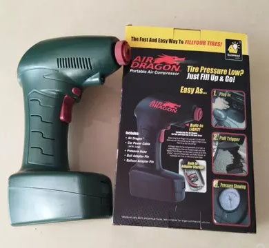 Green air compressor with Air Dragon packaging on a beige background