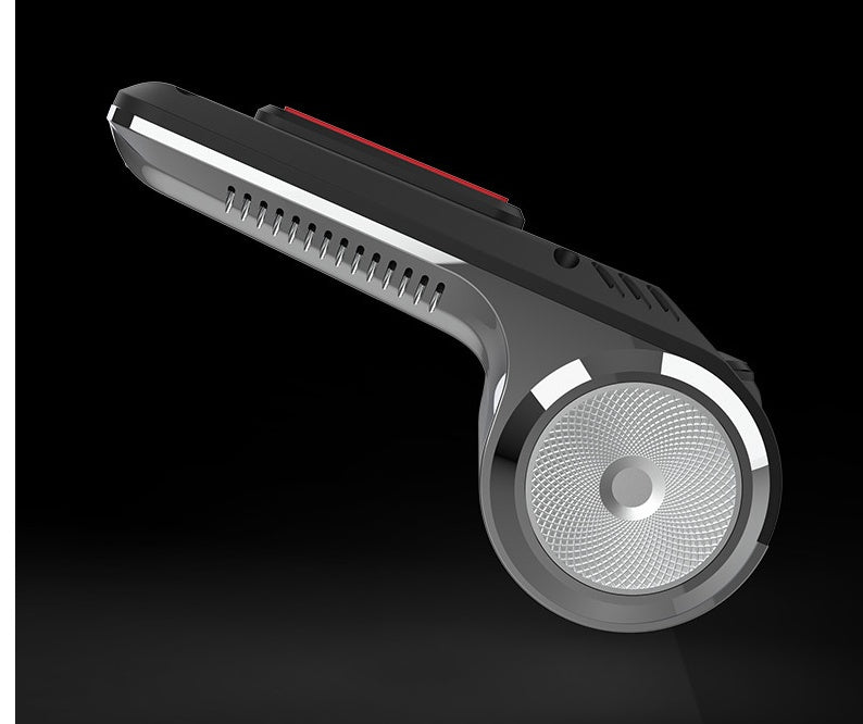 Black and silver rotary shaver on a black background