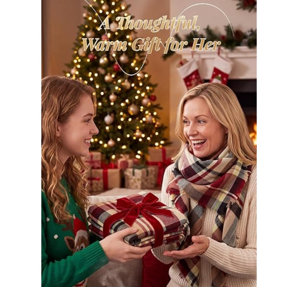Fringed plaid scarf wrap in red and cream tones held during gift giving