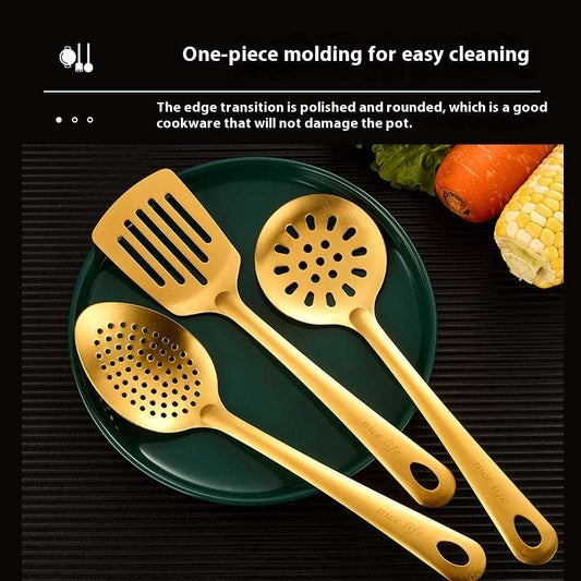 Three gold-colored kitchen utensils on a green plate with vegetables in the background.