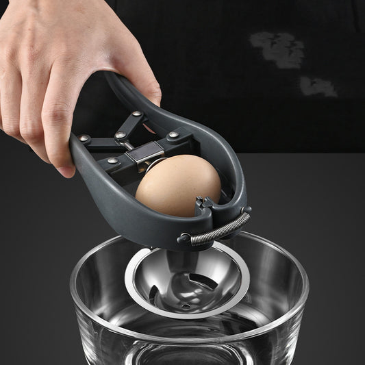Egg separator with a brown egg being cracked into a glass container on a black background