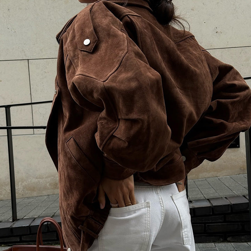 Brown suede zip-up jacket with flap shoulder details and ribbed cuffs