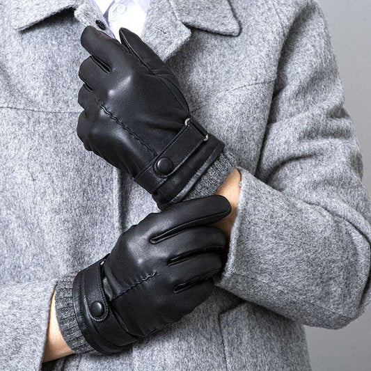 Person wearing black leather gloves with a gray coat