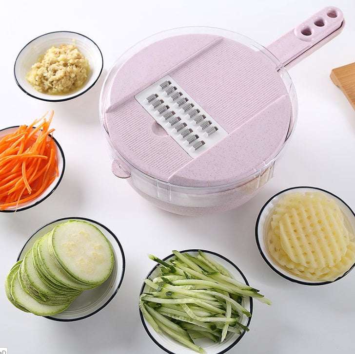 A blue mandoline slicer with various sliced vegetables around it, including cucumbers, carrots, and onions.