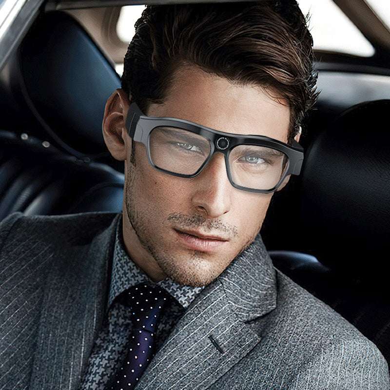Man wearing futuristic glasses inside a car