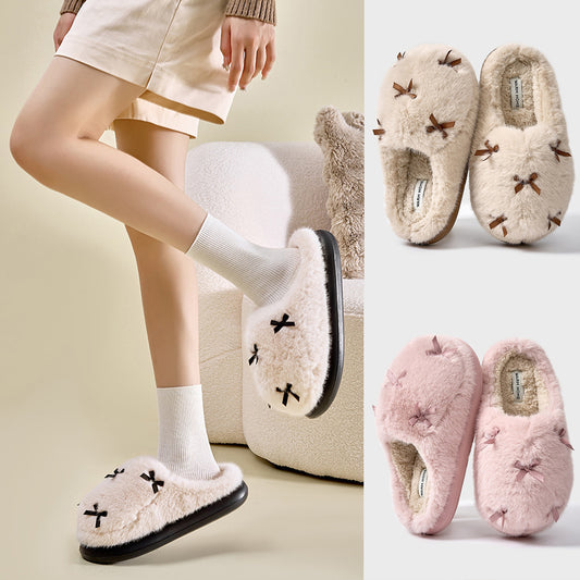 A set of women's plush home slippers with butterfly knot design. The slippers are shown in beige, white, and pink colors with a round toe and thick sole.