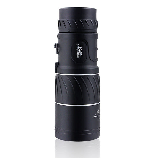 Black monocular telescope on a white background