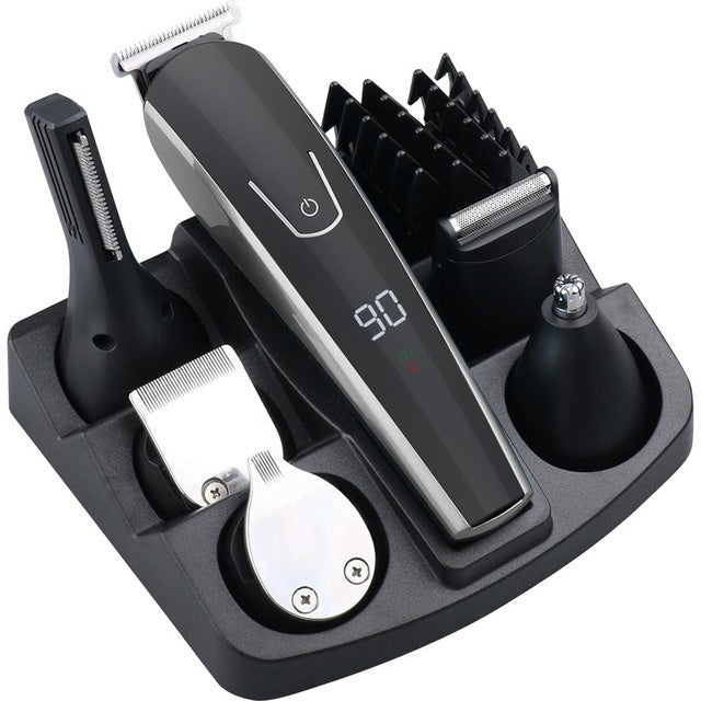 Set of grooming tools including a hair trimmer, beard trimmer, and other attachments on a white background.