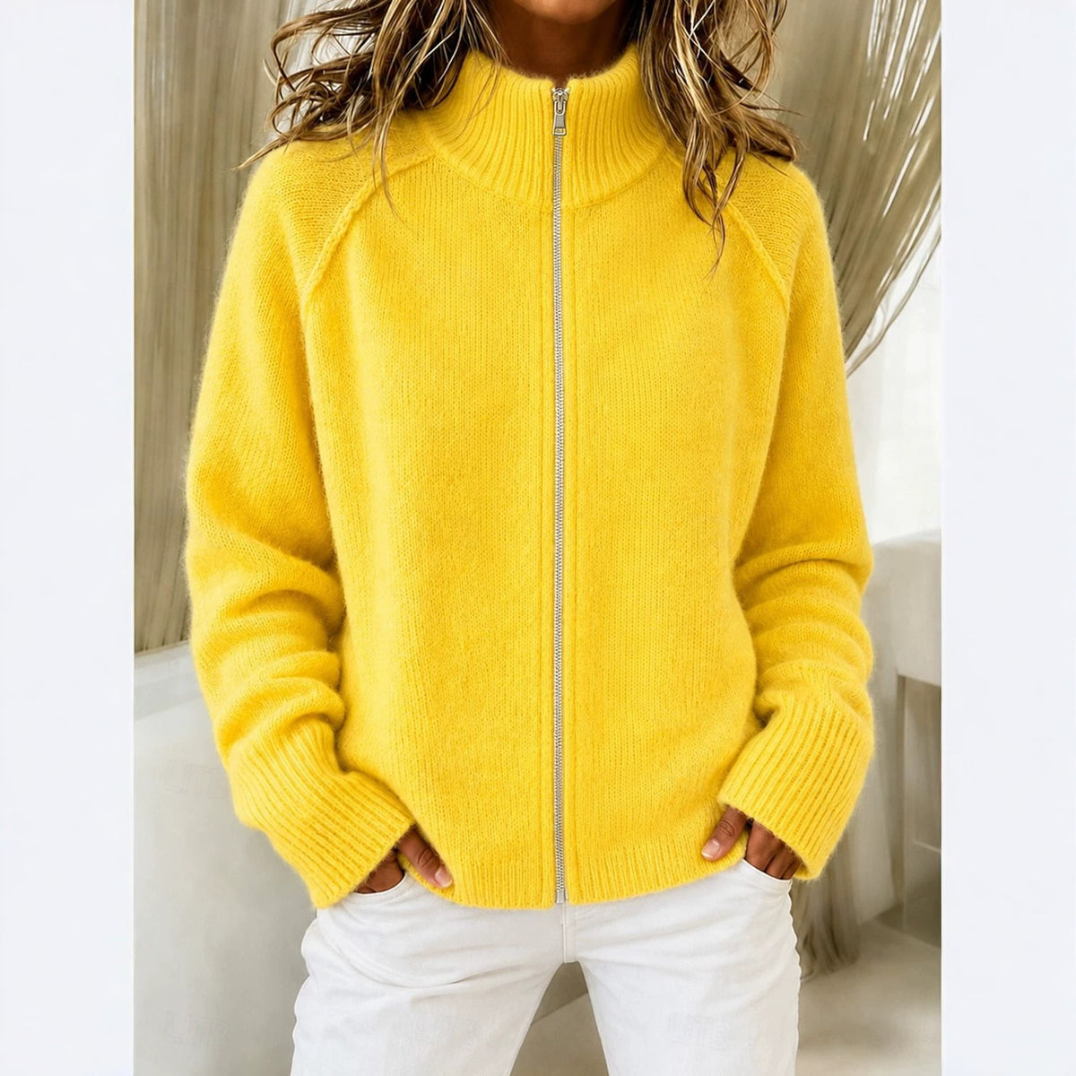 Yellow knitted cardigan with stand collar and front zipper, ribbed cuffs and long sleeves