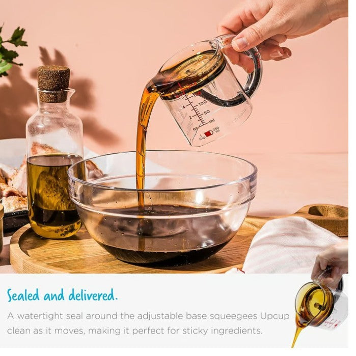 Hand pouring liquid from a measuring cup into a bowl with text about the product's features.