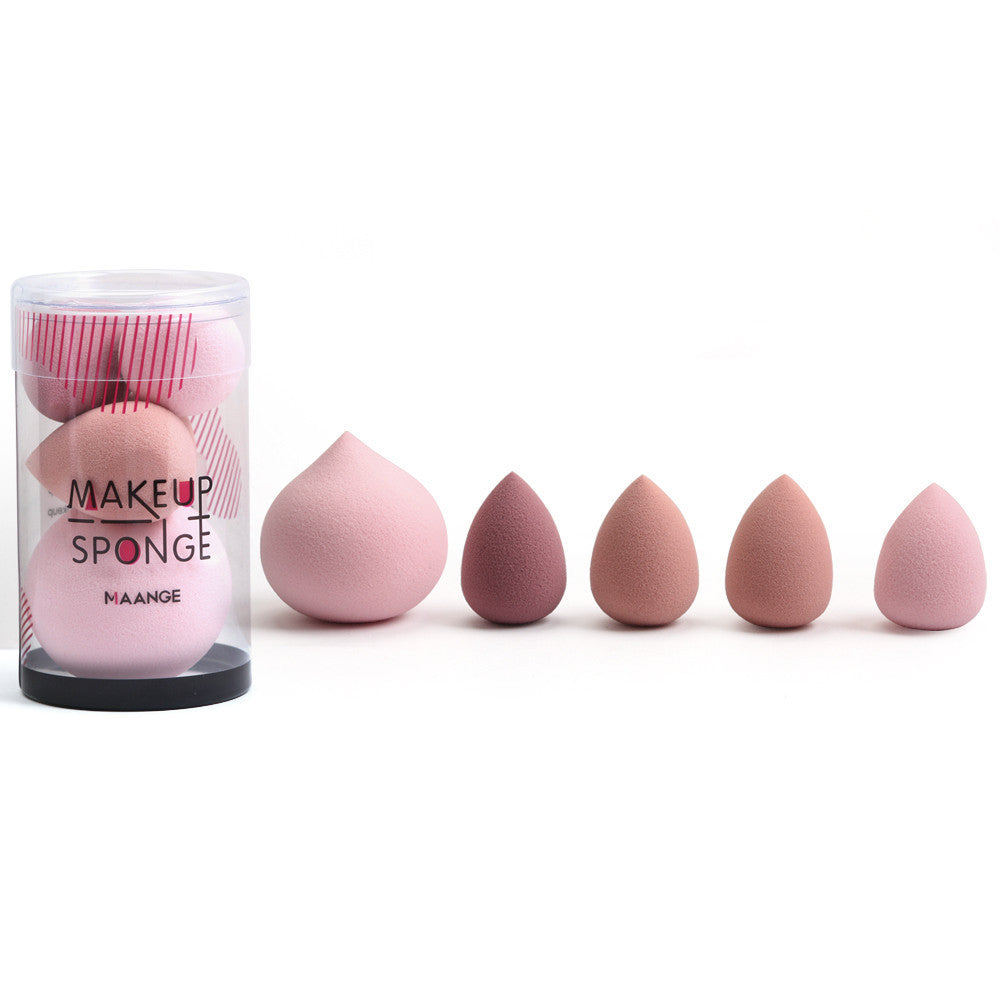 Makeup sponges with a container labeled 'Makeup Sponge' on a white background