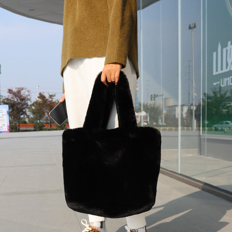 Faux-fur tote handbag, black plush texture with wide body