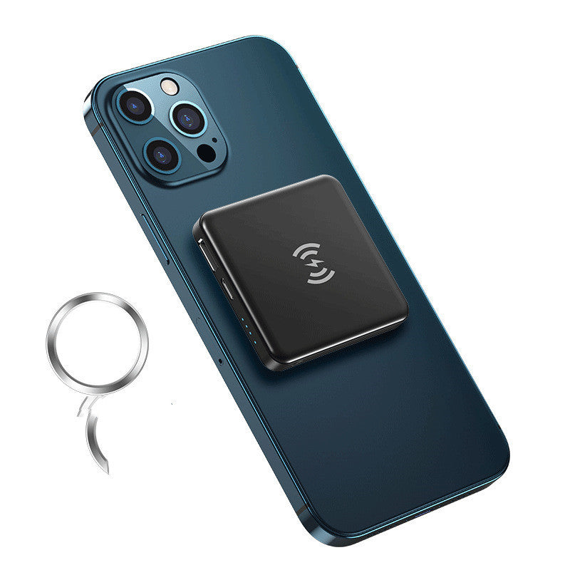 Smartphone with wireless charging pad and keychain on a white background