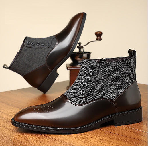 Brown leather ankle boots with black soles on a wooden surface.