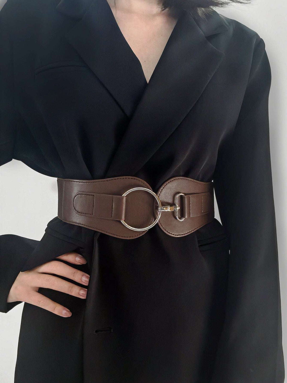 Caramel/brown wide PU elastic belt worn at waist with silver ring and buckle