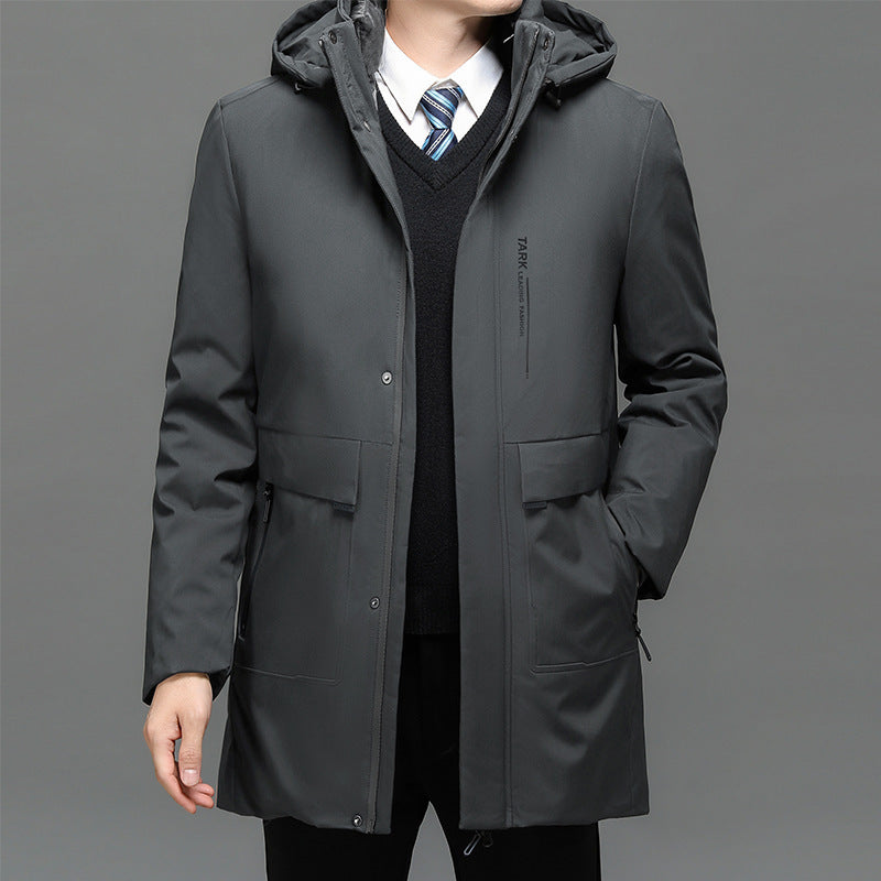 Man wearing a gray coat with a gray background