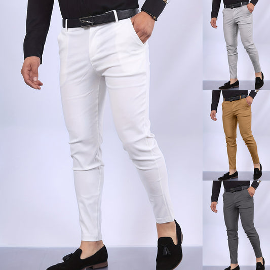 A man modeling a pair of slim-fit, solid-colored trousers featuring a minimalist faux pocket design for a clean, tailored professional look.
