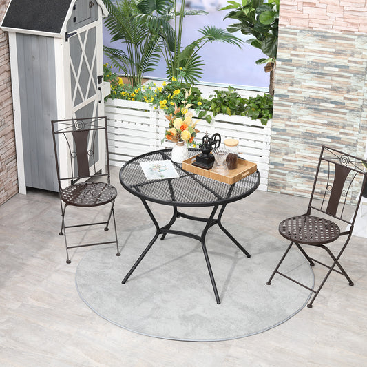 Black 35-inch round metal mesh bistro table in a French Cafe style on a sunny garden patio