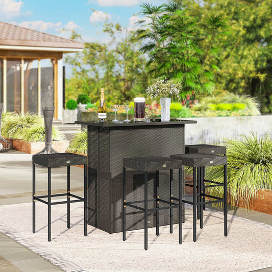 Brown 5-piece rattan wicker bar set with a high-top table and four stools on a garden patio